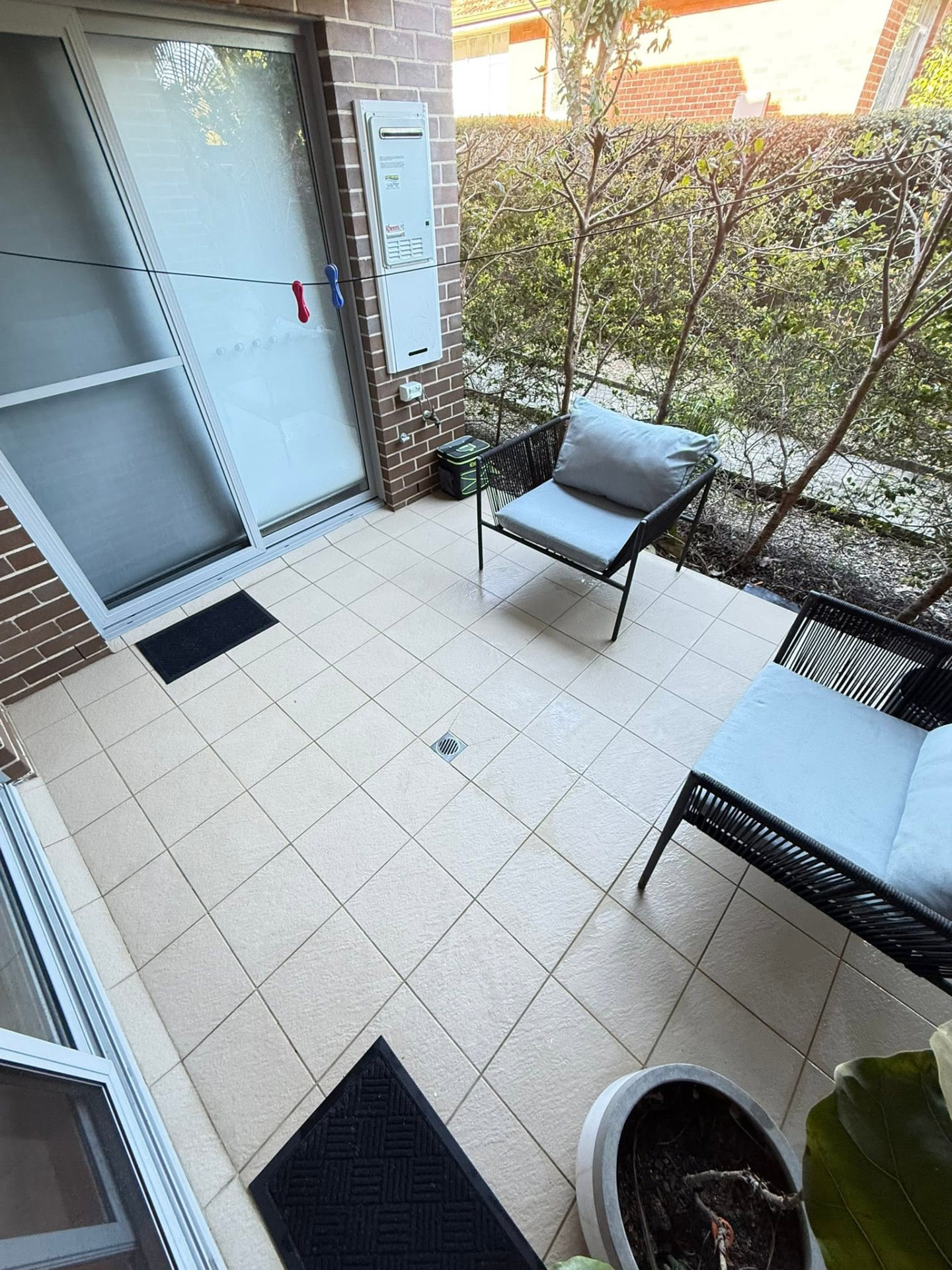 Same courtyard patio tiles restored after Jetmate cleaning